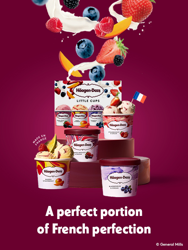 Promotional image for Häagen-Dazs "Little Cups" ice cream line, set against a rich burgundy background. The foreground features a box labeled "Häagen-Dazs Little Cups" surrounded by individual small containers of ice cream in flavors like mango & raspberry, blueberry & cream, and strawberry. Fresh fruit images—mango slices, blueberries, and strawberries—accent the scene, emphasizing natural ingredients. A small French flag and “Made in France” label highlight the product’s origin. At the bottom, the tagline reads: “A perfect portion of French perfection.”